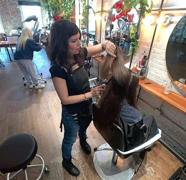 Linet K. working in the salon